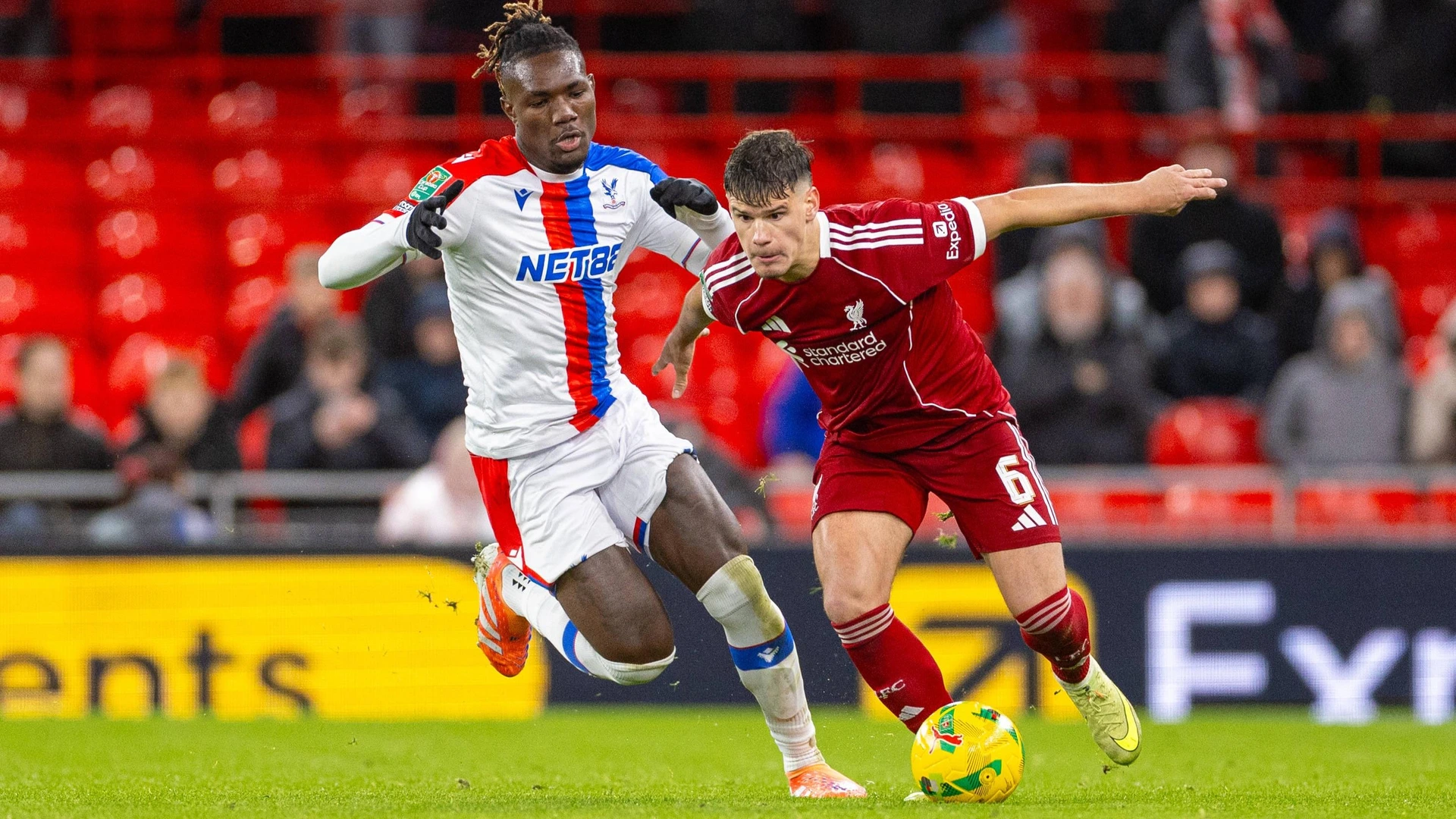 October 29, 2025: Liverpool s Milos Kerkez is challenged by Crystal Palace s Christantus Uche L during the Football League Cup 4th Round match between Liverpool FC and Crystal Palace FC at Anfield.